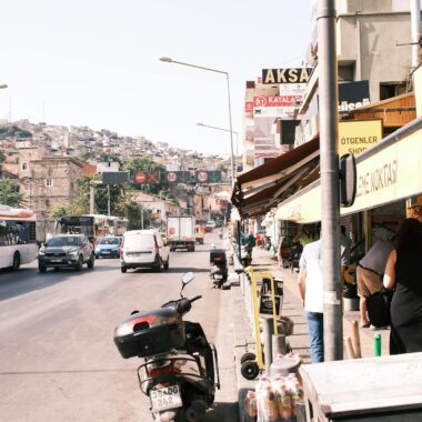 A street scene with a motorcycle and a bus