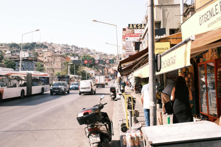 A street scene with a motorcycle and a bus