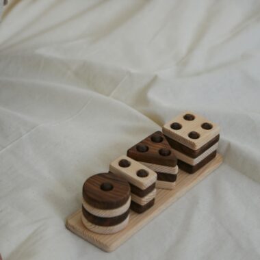 A wooden toy with the word dice on it