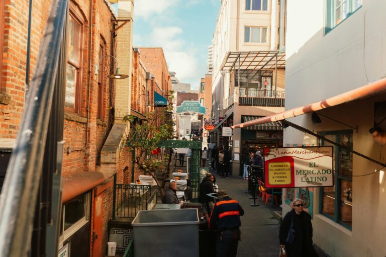 People Walking on Sidewalk Near Buildings